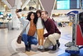 Family selfie, airport and child with parents for travel, diversity and interracial bonding with smile. Man, happy black