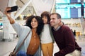 Family selfie, airport and kid with parents for travel, diversity and interracial bonding with smile. Man, happy black