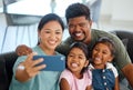 Family selfie, phone smile and parents happy with children on living room sofa, love on video call and relax with Royalty Free Stock Photo