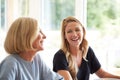 Family With Senior Mother And Adult Daughter Eating Brunch Around Table At Home Together Royalty Free Stock Photo