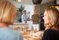 Family With Senior Parents And Adult Offspring Eating Brunch Around Table At Home Together Royalty Free Stock Photo