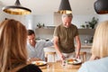 Family With Senior Parents And Adult Offspring Eating Brunch Around Table At Home Together Royalty Free Stock Photo
