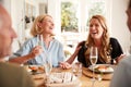 Family With Senior Parents And Adult Offspring Eating Brunch Around Table At Home Together Royalty Free Stock Photo