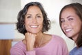 This family shared good genes. A mother and daughter smiling happily at the camera. Royalty Free Stock Photo