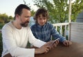 Family shopping online via the terrace on a summer evening Royalty Free Stock Photo