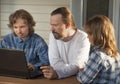 Family shopping online via the terrace on a summer evening Royalty Free Stock Photo