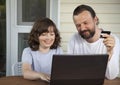 Family shopping online via the terrace on a summer evening Royalty Free Stock Photo