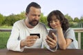 Family shopping online via the terrace on a summer evening Royalty Free Stock Photo