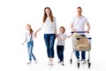 happy young family with two kids walking with shopping trolley Royalty Free Stock Photo