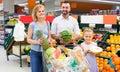 Family shopping various fresh fruits in supermarket Royalty Free Stock Photo