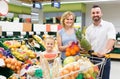 Family shopping various fresh fruits in supermarket Royalty Free Stock Photo