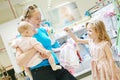 Family shopping. woman with baby in shop Royalty Free Stock Photo