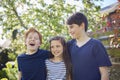 Family Shot With Loving Brothers And Sister In Garden At Home Together Royalty Free Stock Photo