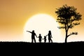 Family silhouette of on sunset and tree background Royalty Free Stock Photo