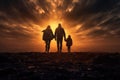 a family silhouette walking towards a vibrant sunset sky. christian family concept. Royalty Free Stock Photo