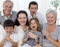 Family singing karaoke at home