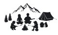 Family sit around campfire silhouette scene