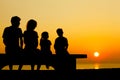 Family sit on bench on beach Royalty Free Stock Photo