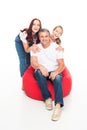 Family sitting on bean bag chair Royalty Free Stock Photo