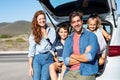 Family sitting in car trunk Royalty Free Stock Photo