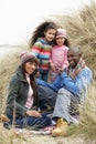 Family Sitting In Dunes Enjoying Picnic On Winter Royalty Free Stock Photo