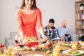 Family sitting at home, preparing celebrate traditional christmas dinner Royalty Free Stock Photo