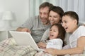 Family sitting with laptop Royalty Free Stock Photo