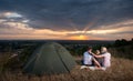 Family sitting near camp tent on the hill Royalty Free Stock Photo