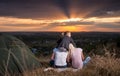 Family sitting near camp tent on the hill Royalty Free Stock Photo