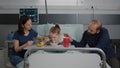 Family sitting with sick girl daughter while eating healthy nutrition meal food Royalty Free Stock Photo