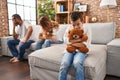 Family sitting on sofa and kid sad for partents argue at home Royalty Free Stock Photo