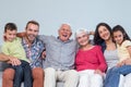 Family sitting on sofa Royalty Free Stock Photo