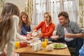 Portrait of parents with children eating at home Royalty Free Stock Photo