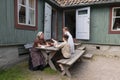 Family sitting on the table in old town