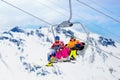 Family in ski lift in mountains. Skiing with kids Royalty Free Stock Photo