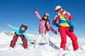 Group of young girls and teenage girls on winter vacation in the mountains posing in the snow on the ski slopes