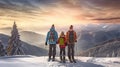 A family of skiers looks at the snow-capped mountains at a ski resort, during vacation and winter holidays.