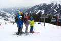 Family, skiing in winter ski resort on a sunny day, enjoying nature Royalty Free Stock Photo