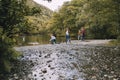 Family Skimming Stones at the Lake District Royalty Free Stock Photo