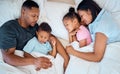 Family, sleeping and in bed together, love and care with parents and children at family home. Mother, father and kids Royalty Free Stock Photo