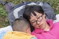 Family sleeping on lawn