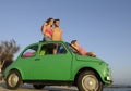 Family with small car on vacation Royalty Free Stock Photo