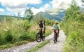 Family with small children cycling outdoors in summer nature. Royalty Free Stock Photo