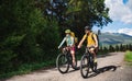 Family with small children cycling outdoors in summer nature, High Tatras in Slovakia. Royalty Free Stock Photo
