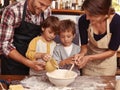 Family, smile and kids baking in kitchen, learning or happy boys bonding together with parents in home. Father, mother Royalty Free Stock Photo