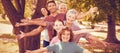 Family smiling in park Royalty Free Stock Photo