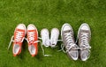 Family sneakers canvas mother father and child shoes on green grass in happy family lifestyle