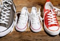 Family Sneakers canvas shoes parents and child on wood floor at home in happy lifestyle