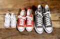 Family Sneakers canvas shoes parents and child on wood floor at home in happy lifestyle