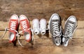 Family Sneakers canvas shoes parents and child on wood floor at home in happy lifestyle